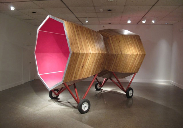 ^Graem Whyte Make Love Not War (2012). Latex on modified ping pong tables, wood paneling, aluminum, steel, wheels, 6′ 4″ x 8′ 4″ x 11′. Image courtesy of the artist.