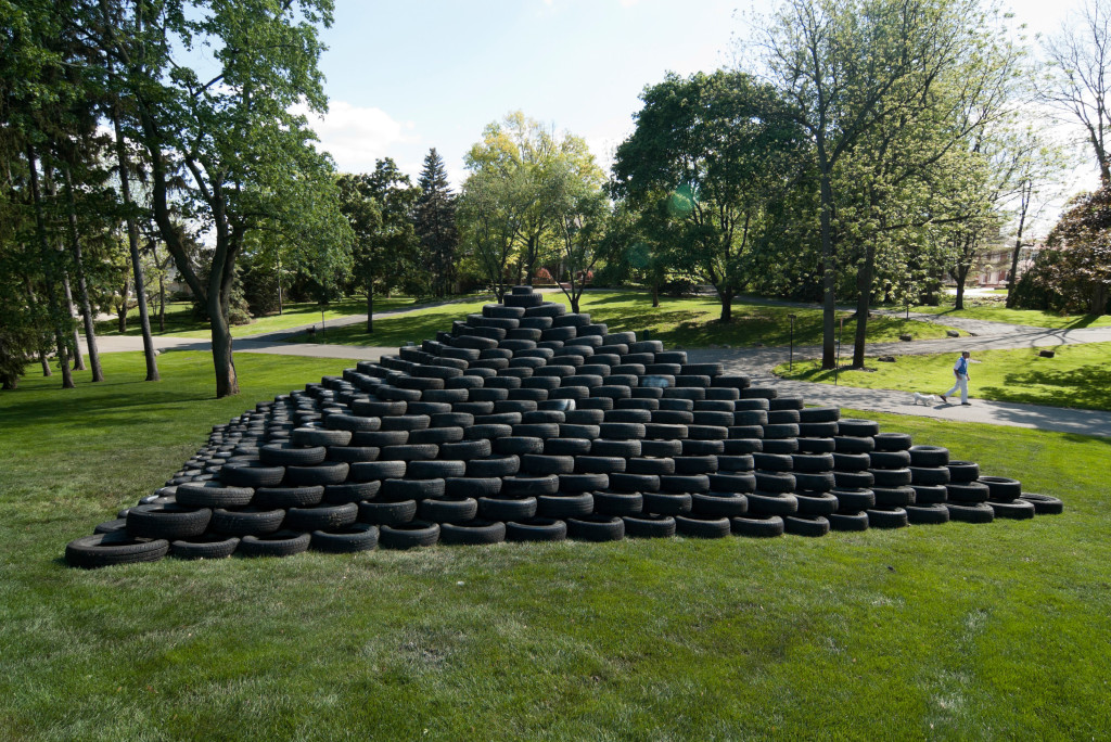 Fig. 18. (above) Tire Pyramid Lawn After Removal, (below) Tire Pyramid with Man and Dog, Scott Hocking, 2006. Images courtesy of the artist.