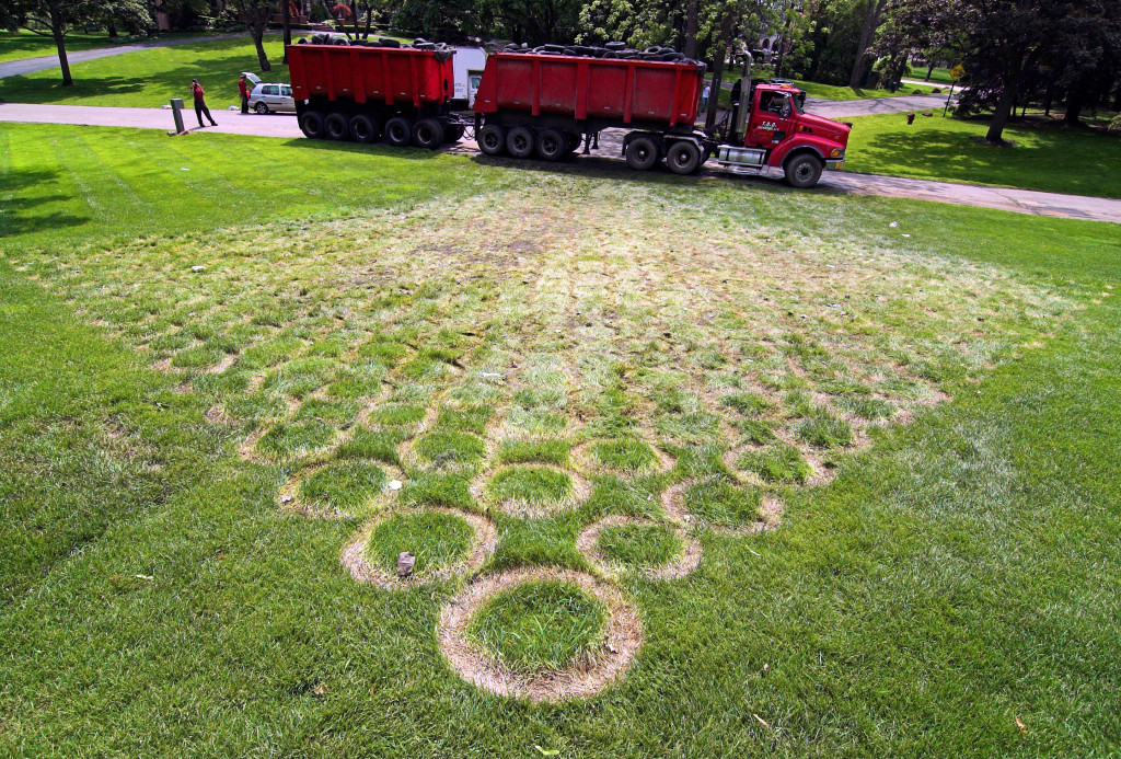 Fig. 18. (above) Tire Pyramid Lawn After Removal, (below) Tire Pyramid with Man and Dog, Scott Hocking, 2006. Images courtesy of the artist.